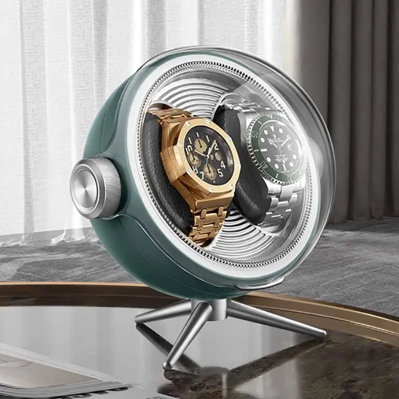 Modern watch winder displaying two luxury wristwatches on a table in a stylish room