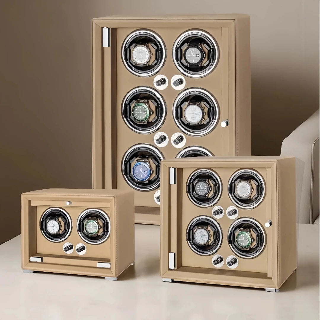 Beige leather watch winders with multiple slots for automatic watches on a table