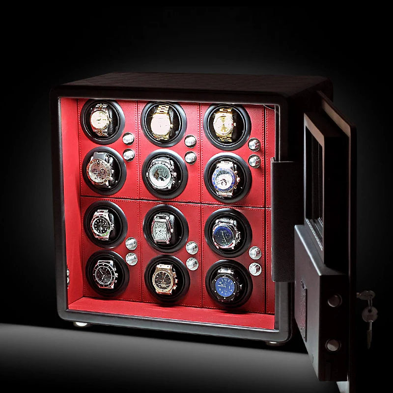 Luxury watch winder safe with red interior, holding multiple automatic watches.